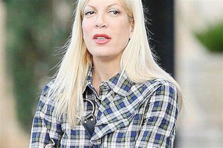 EXCLUSIVE Tori Spelling's REVENGE romance! Star pictured passionately