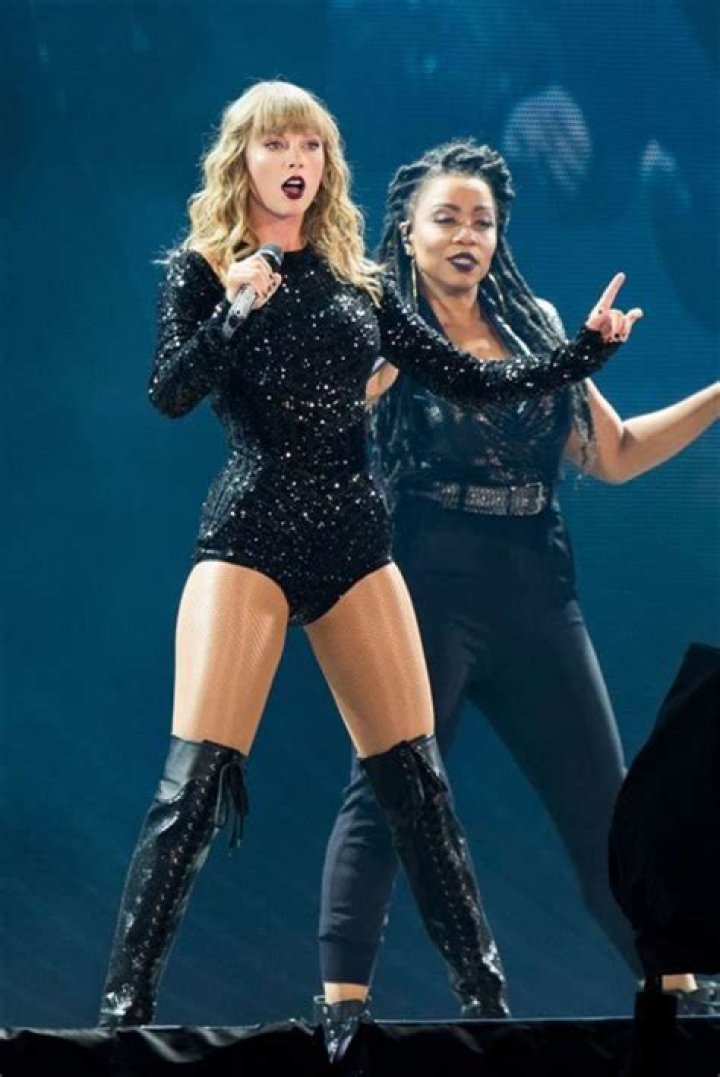 Taylor Swift is a statuesque beauty in glittering bodysuit and thigh-high boots