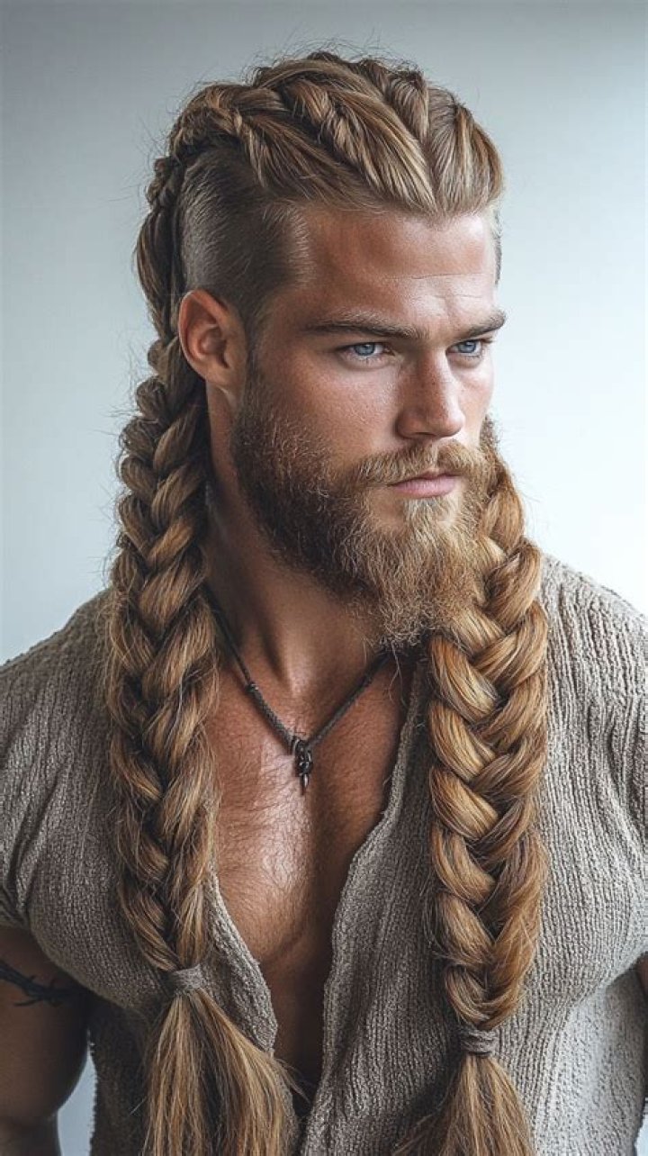 viking braids, two long braids, in front of the face, man with black